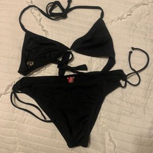 GUESS black bikini set with gold G medal logos.